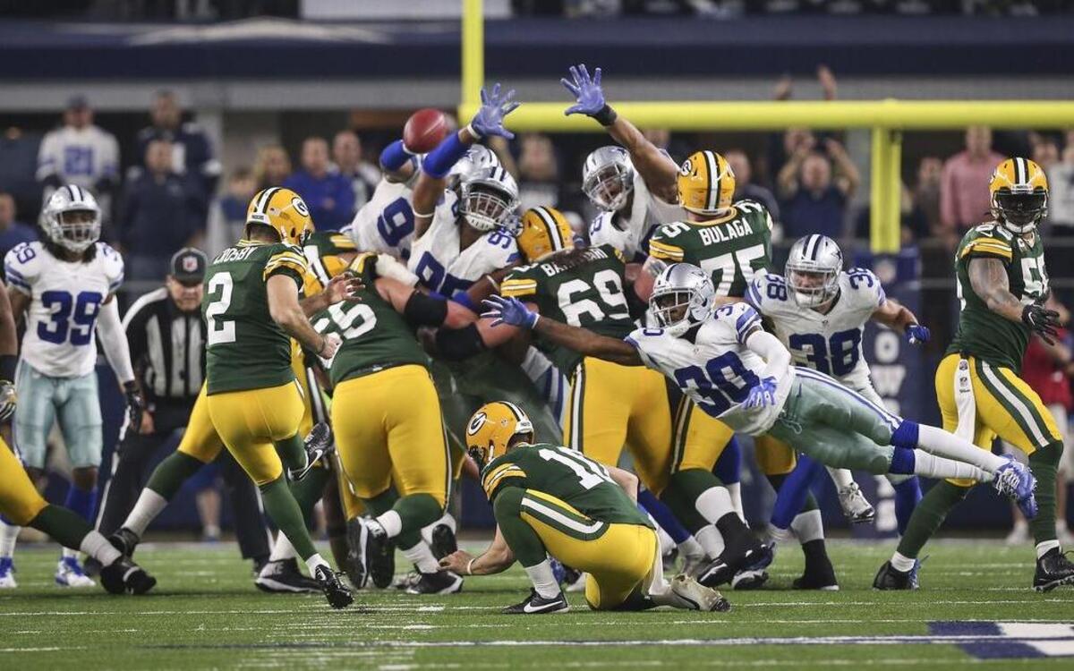 Green Bay Packers kicker Mason Crosby kicks the game winning field goal against the Dallas Cowboys in an NFC Divisional playoff game at AT&T Stadium Dunday.