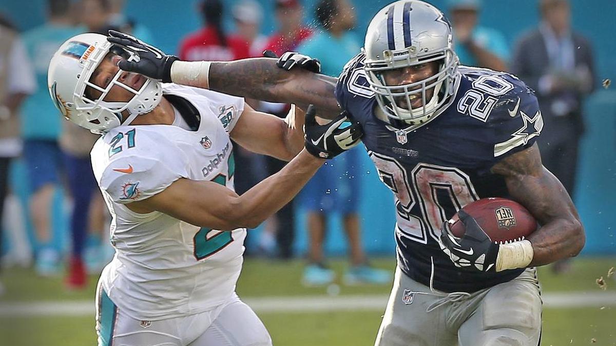 Miami Dolphins' Brent Grimes gets stiff-armed by Dallas Cowboys running back Darren McFadden during the fourth quarter on Sunday, Nov. 22, 2015, at Sun Life Stadium in Miami.