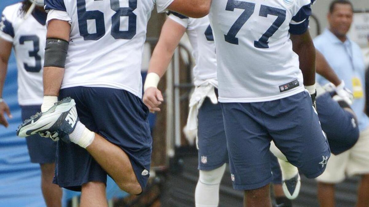 Cowboys tackle Tyron Smith (77) returned to practice Wednesday after missing the past two games with a bulging disc in his back.