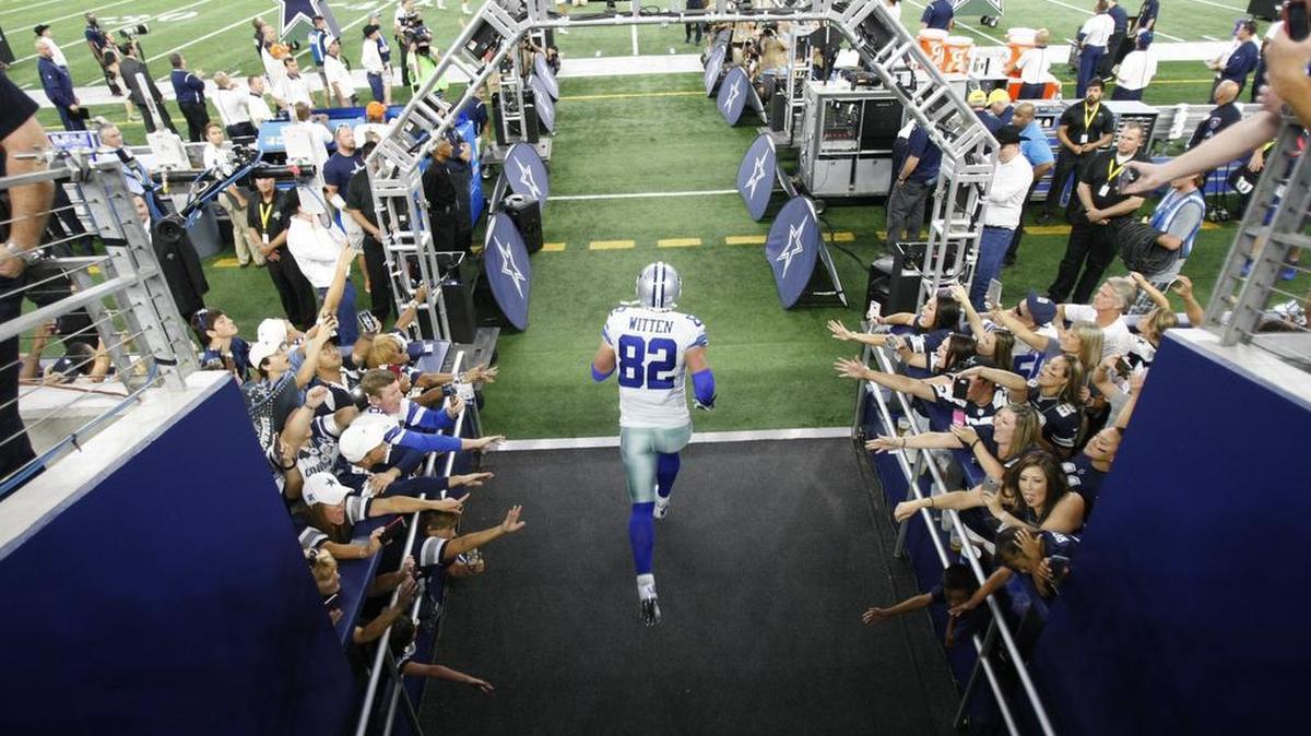 
Jason Witten runs through a gauntlet of fans during player introductions before Sunday night’s opener against the New York Giants at AT&T Stadium.
