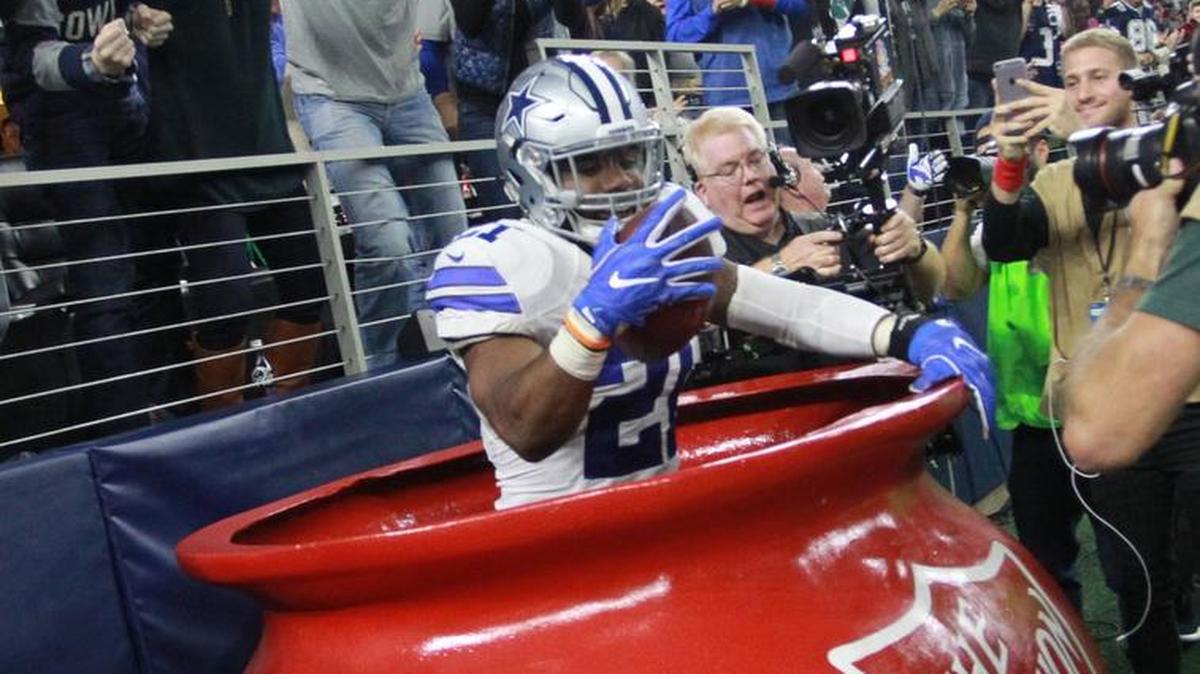 Dallas Cowboys running back Ezekiel Elliott celebrated a touchdown by jumping into a Salvation Army red kettle at AT&T Stadium during a game against Tampa Bay in December 2016.