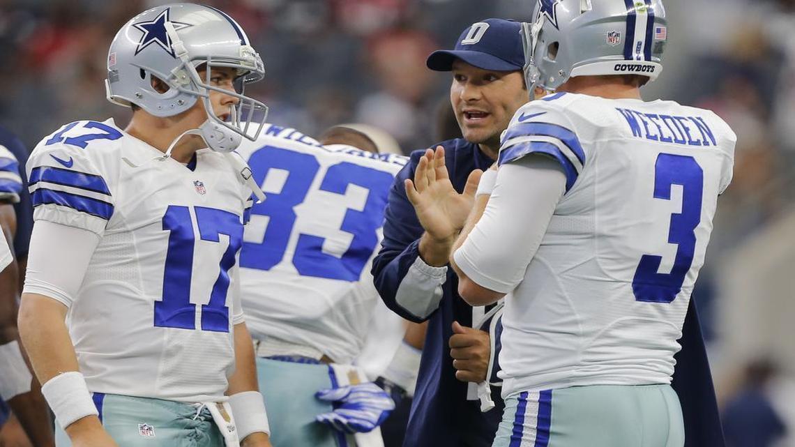 
An injured Tony Romo gives advice to his replacement quarterbacks Kellen Moore and Brandon Weeden during warmups before the game as the Atlanta Falcons play the Dallas Cowboys in AT&T Stadium in Arlington, Texas, Sunday, September 27, 2015.
