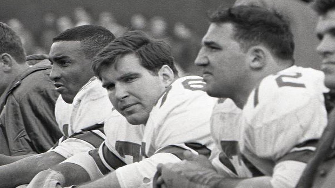 Tony Liscio, second from right, is on the Dallas Cowboys bench during a game at the Cotton Bowl in 1966. No. 76 is John Niland.