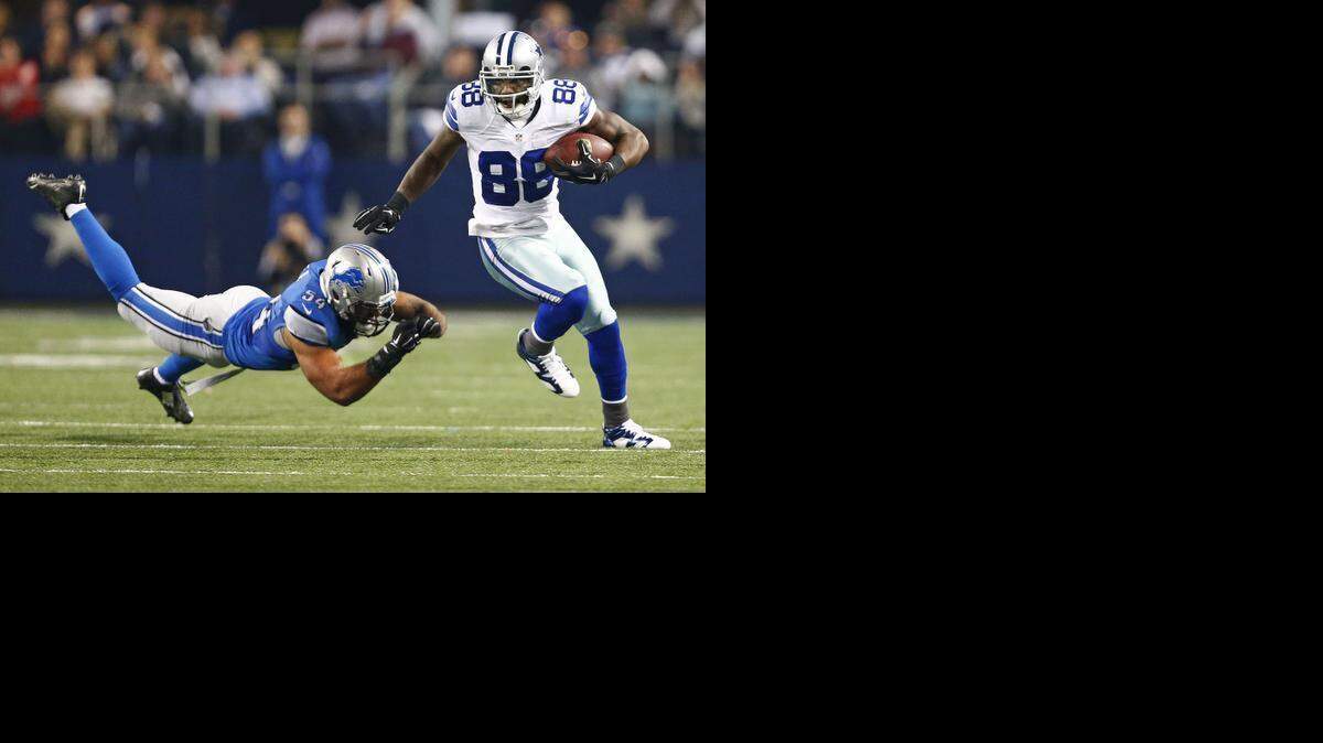 
The Cowboys have until July 15 to sign Dez Bryant, right, to a long-term deal, or he’ll play the 2015 season at the $12.8 million franchise tag. 



