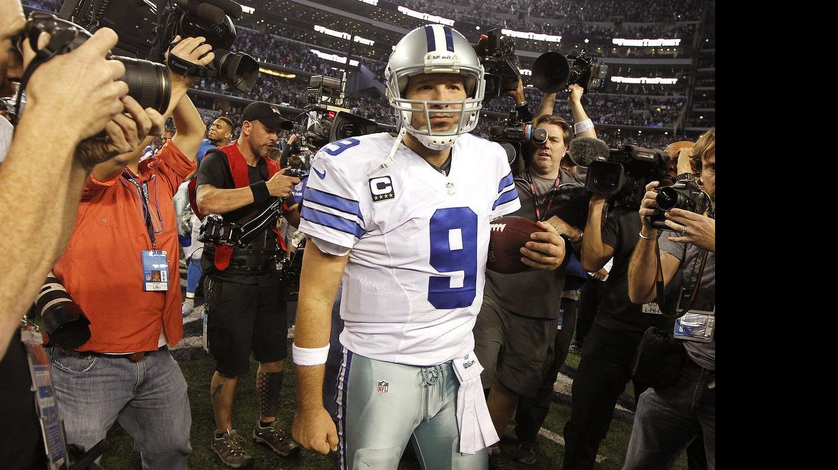
Tony Romo, shown walking off the field after the team’s wild-card playoff win, is participating in his first full off-season in three years.
