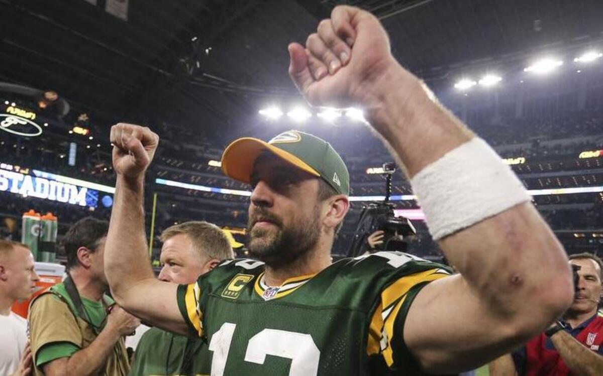 Packers quarterback Aaron Rodgers celebrates after the 34-31 victory over the Dallas Cowboys at AT&T Stadium.