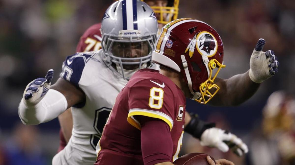 Dallas Cowboys defensive end DeMarcus Lawrence (90) closes in on Washington Redskins quarterback Kirk Cousins (8) in the first quarter. Cousins fumbled on the play and Dallas Cowboys defensive tackle Maliek Collins (96) recovered.