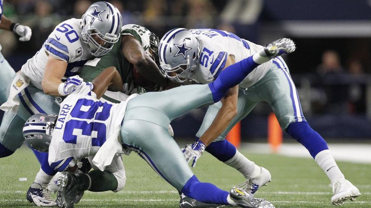 Linebacker and special teams player Kyle Wilbur, right, will return to the Dallas Cowboys next season.