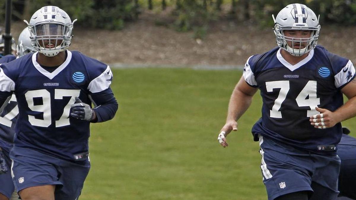 Dallas Cowboys defensvie tackle Joey Ivie, right, runs drills alongside defensive end Taco Charlton (97). The Dallas Cowboys held their second day of the team’s rookie minicamp at Ford Center at The Star in Frisco, Saturday, May 13, 2017.