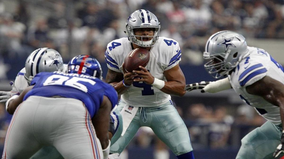 Dallas Cowboys rookie quarterback Dak Prescott bobbles a snap, but his play was solid in his NFL debut.