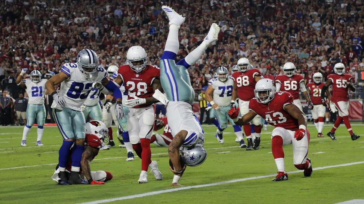 Cowboys quarterback Dak Prescott flipped over defenders after diving for a touchdown in the second quarter to tie the Cardinals 7-7 during a Monday Night Football game in Arizona.