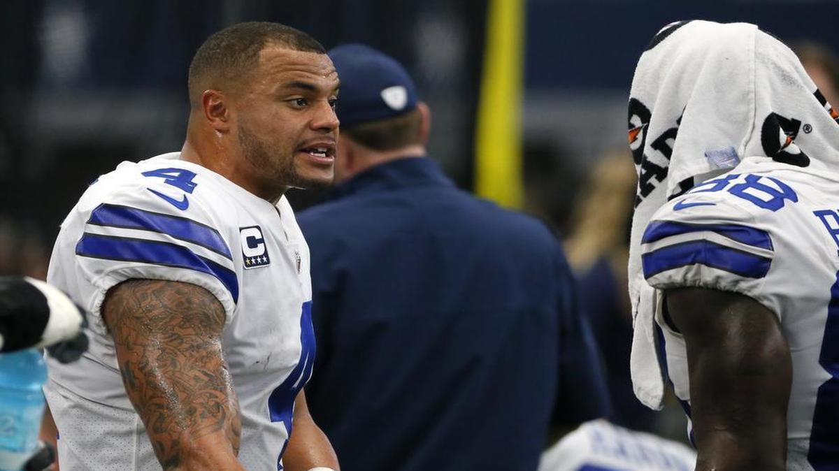 Cowboys quarterback Dak Prescott, left, talks on the sideline with receiver Dez Bryant during a game against the Los Angeles Rams.