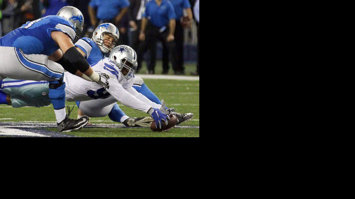 
Lions tackle Riley Reiff, left, and quarterback Matthew Stafford, center, try to recover the fumble as Cowboys defensive end Demarcus Lawrence grabs the ball at the end of the fourth quarter
