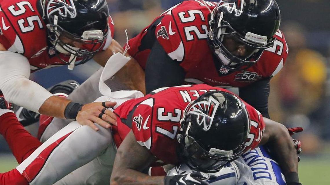 

Falcons linebacker Justin Durant,  top right, was all over Lance Dunbar and his other ex-teammates. 
