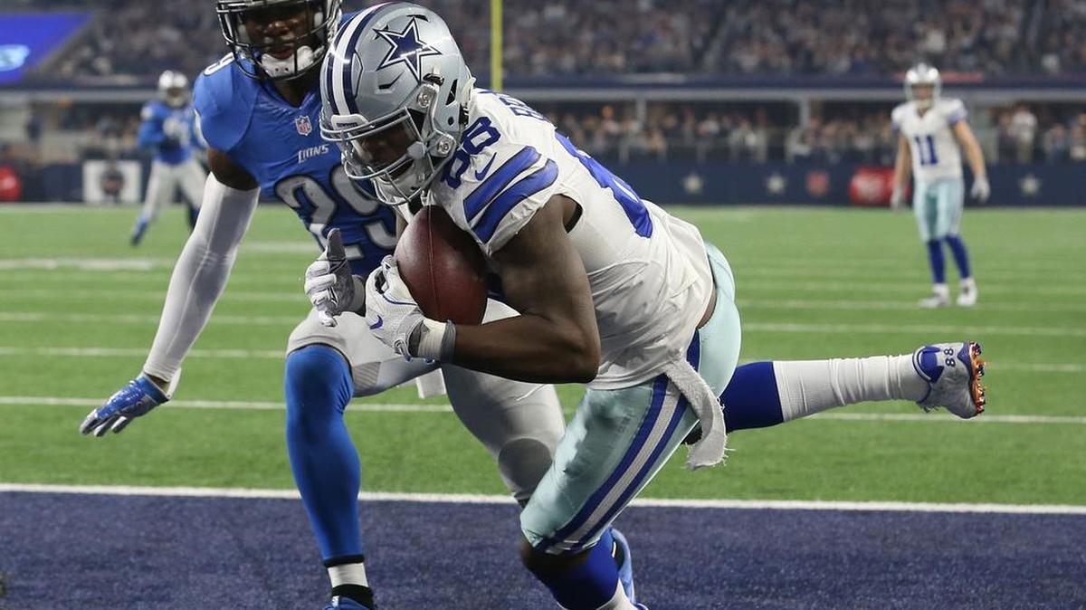 Dallas Cowboys wide receiver Dez Bryant makes a one-handed touchdown catch over Detroit Lions cornerback Johnson Bademosi in the second quarter.