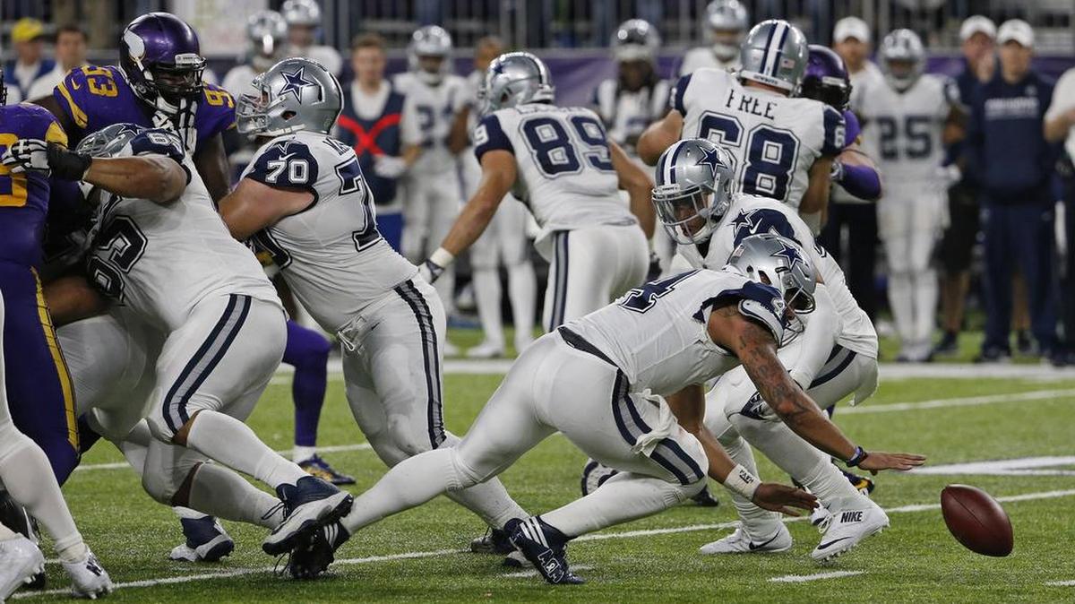 Cowboys quarterback Dak Prescott (4) fumbled the snap from Travis Frederick late in Thursday’s game. Ezekiel Elliott recovered.