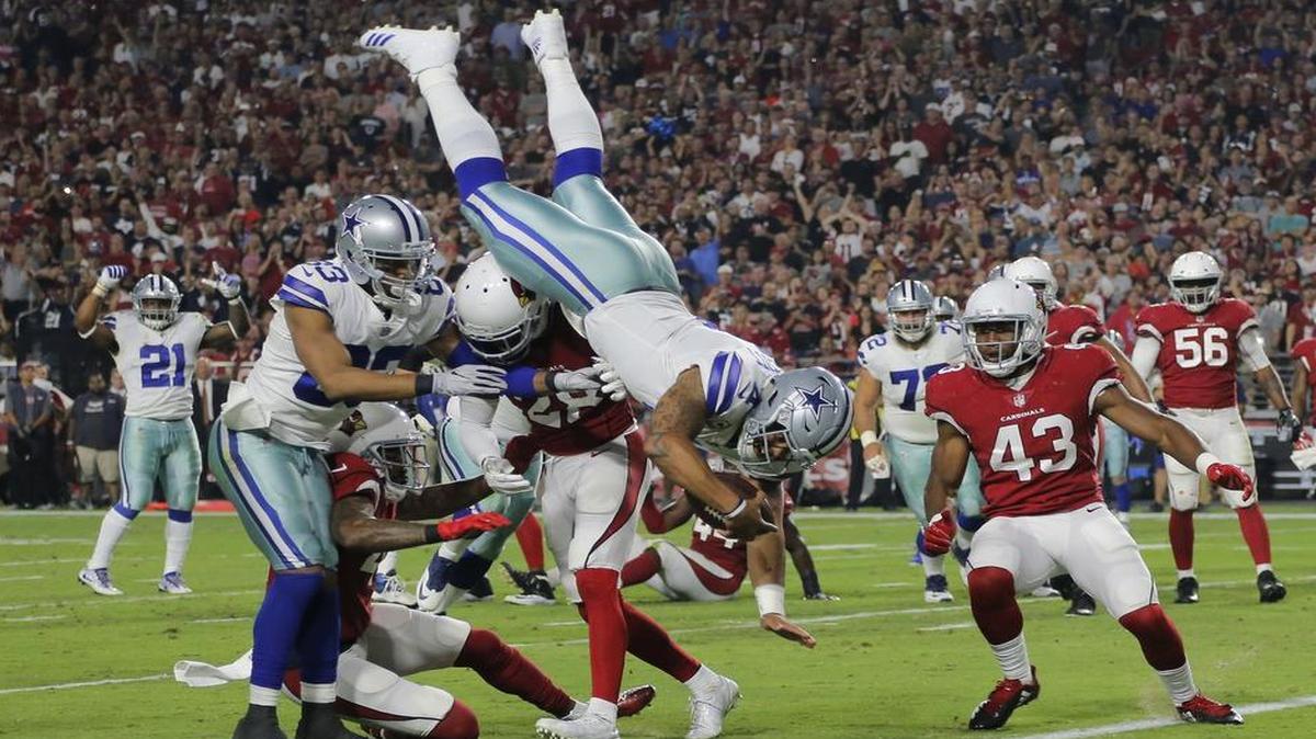 Dallas Cowboys quarterback Dak Prescott dives for a touchdown in the second quarter.