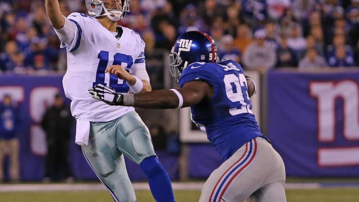 Under pressure, Dallas Cowboys quarterback Matt Cassel (16) heaves the ball to Devin Street for a fourth quarter touchdown. The New York Giants beat the Dallas Cowboys 27-20 at MetLife Stadium.