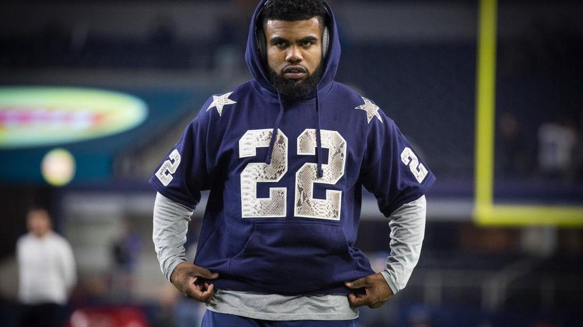 Ezekiel Elliott wears an Emmitt Smith jersey before the Cowboys play the Lions, Dec. 26, 2016.