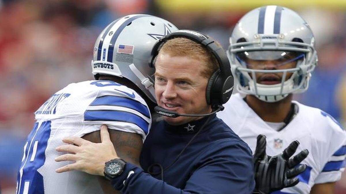 
Cowboys wide receiver Dez Bryant, left, receives a hug from head coach Jason Garrett after a scoring play.
 
