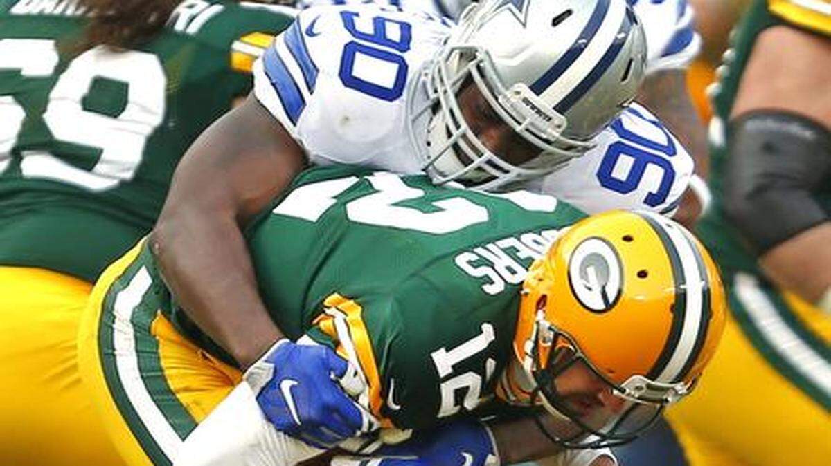 
Cowboys defensive end DeMarcus Lawrence, top, was the only player to sack Green Bay Packers quarterback Aaron Rodgers. 
