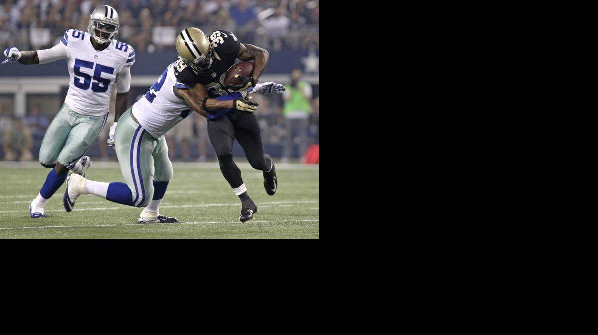 
Justin Durant (52) makes a tackle in a game against the Saints as Rolando McClain (55) looks on. The Cowboys had hoped to get both back for 2015.
