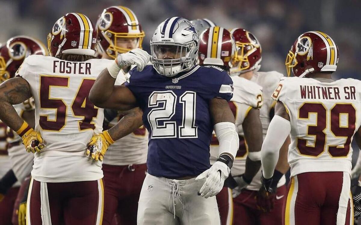 Dallas Cowboys running back Ezekiel Elliott (21) gives the ‘feed me’ sign after gaining a first down against the Washington Redskins on Thursday in Dallas. The Cowboys won 31-26 to improve to 10-1 on the season.