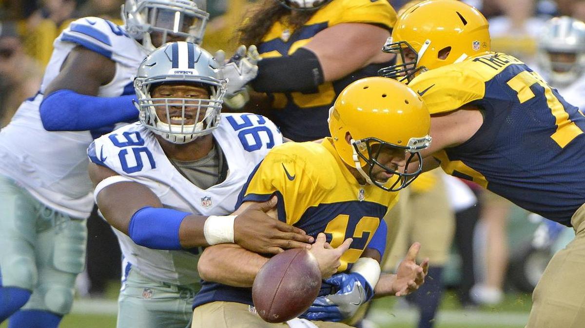 David Irving’s hit causes Green Bay Packers quarterback Aaron Rodgers to fumble the ball during the third quarter of Sunday’s game. Irving is the NFC defensive player of the week.