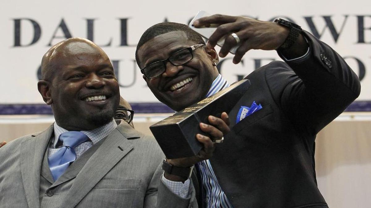 
Emmitt Smith and Michael Irvin take a "selfie" after Smith was awarded the Tom Landry Legends Award by Irvin at the Cowboys Kickoff Luncheon at At&T Stadium, Wednesday, September 2, 2015. 

