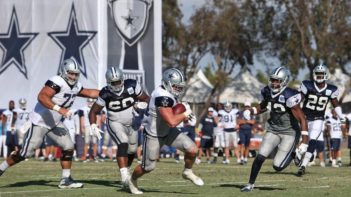 
Dallas Cowboys fullback Tyler Clutts (44) breaks away on a touchdown run during the Cowboys afternoon practice, causing the defense to get chewed out by coach Jason Garrett.
