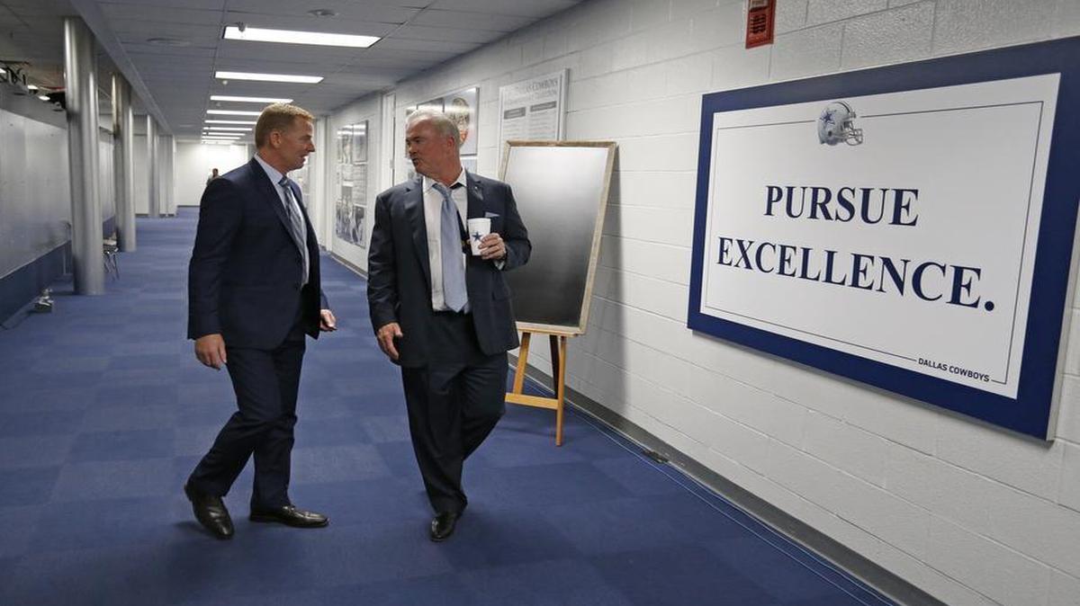 Cowboys coach Jason Garrett, left, and executive vice president Stephen Jones head to the team’s post-draft news conference in April inside Valley Ranch headquarters. The facility has served as a second home for the Cowboys for the past 31 years.