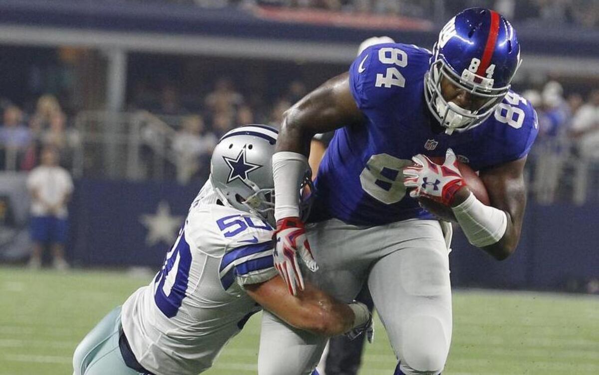 
Linebacker Sean Lee, left, and the Cowboys made just enough stops against tight end Larry Donnell and the Giants to give the Dallas offense one last chance Sunday night.

