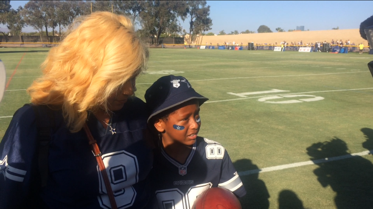 Joshua Williams (right) with his mom Jessica (left) at Cowboys camp on Tuesday.