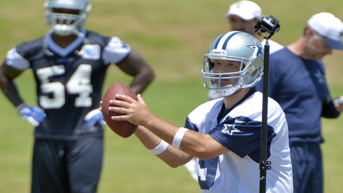 
Dallas Cowboys quarterback Tony Romo runs through some drills as virtual reality cameras record the practice for later training during practice at Valley Ranch.
