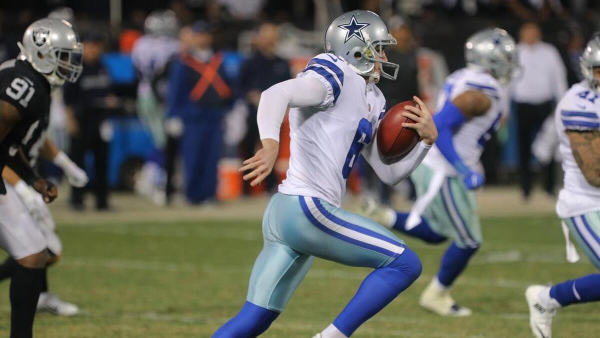 Dallas Cowboys punter Chris Jones fakes a punt and runs for a 24-yard gain late in the third quarter Sunday night against the Oakland Raides at Oakland Alameda County Coliseum.