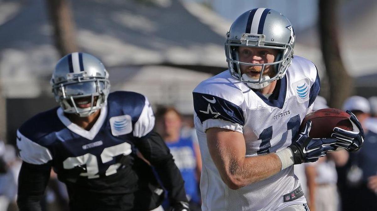 
Dallas Cowboys wide receiver Cole Beasley (11) beats Dallas Cowboys cornerback Orlando Scandrick (32) on a short pass play during the Cowboys afternoon practice at their 2015 training camp in Oxnard, California, Sunday, August 2, 2015.

