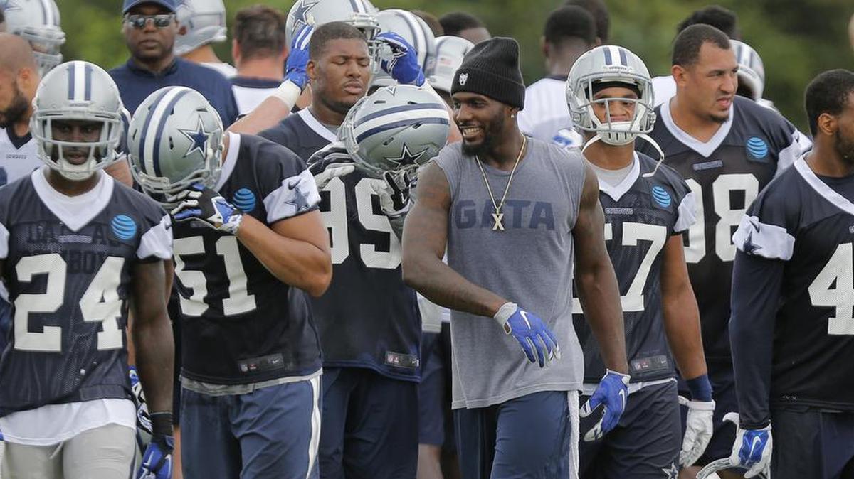 Cowboys receiver Dez Bryant jokes with teammates during Wednesday’s organized team activity.