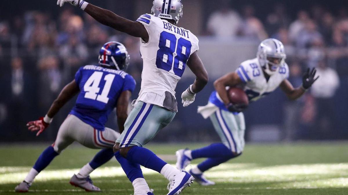 Cowboys receiver Dez Bryant (88) motioned for Terrance Williams (83) to get out of bounds as time wound down in the season opener.