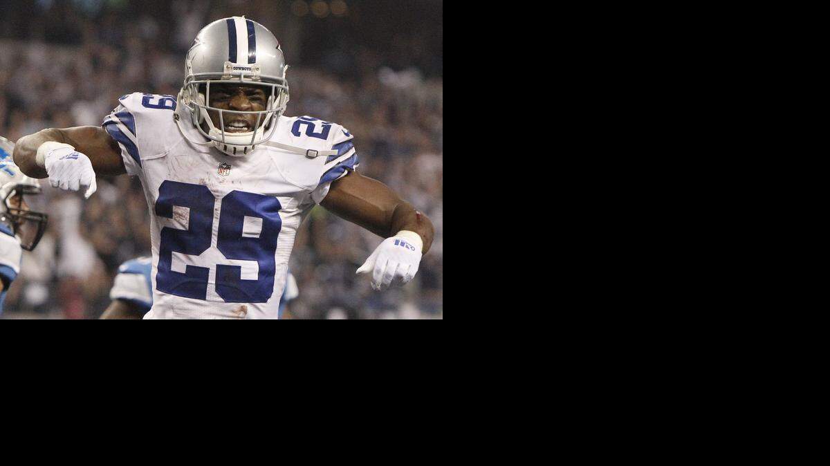 
DeMarco Murray celebrates a touchdown in a playoff game against the Lions. He signed a deal with the Eagles on Thursday.


