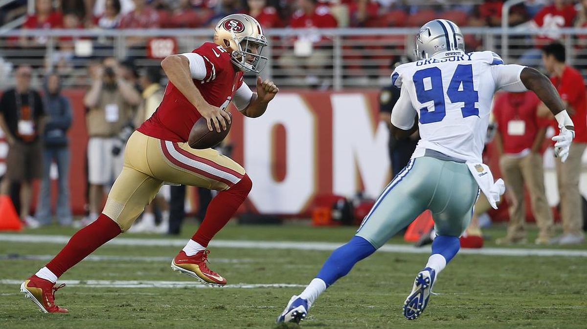 
Cowboys rookie defensive end Randy Gregory chases 49ers backup quarterback Blaine Gabbert in the first half Sunday.

