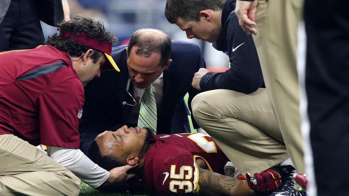 Redskins cornerback Dashaun Phillips, of Duncanville, is examined by medical staff after being injured in the second quarter. Phillips was carted off the field and transported to a local hospital for further evaluation of a neck injury. The Redskins reported that he had movement in his extremities.