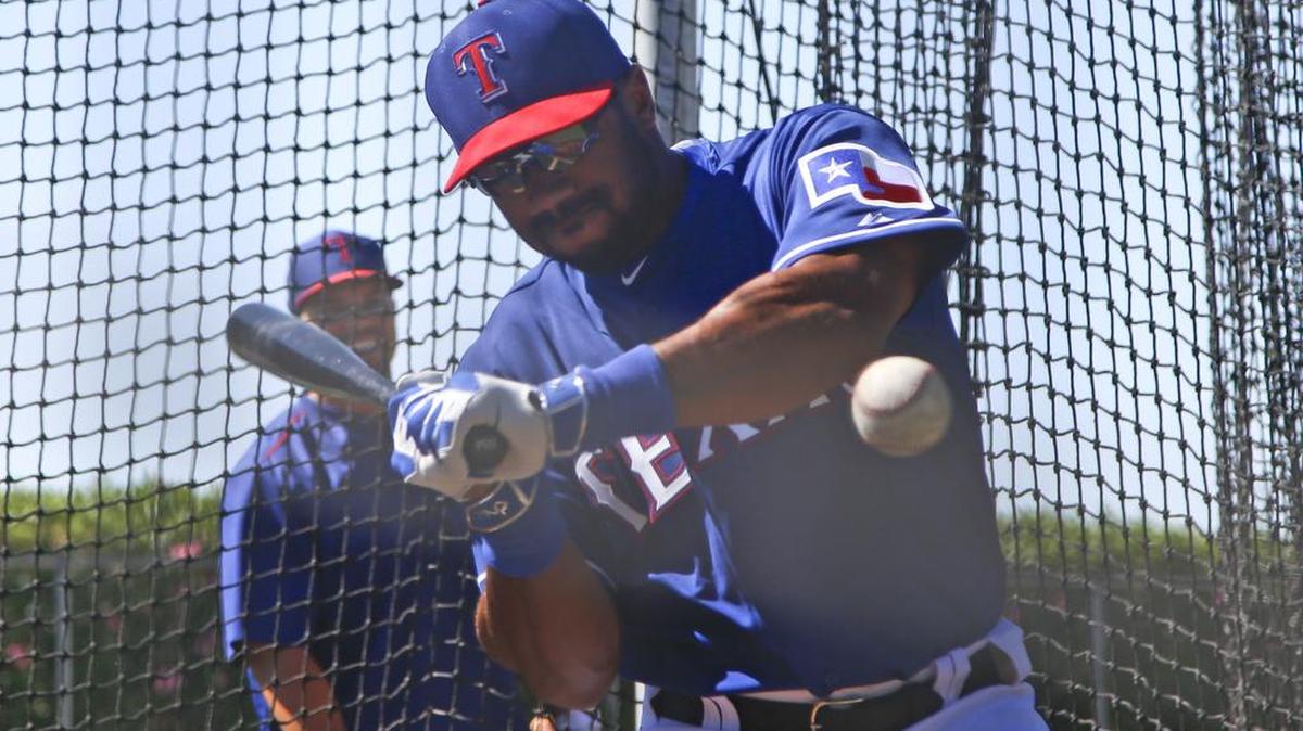 Seattle Seahawks quarterback Russell Wilson worked with the Texas Rangers, who own his baseball rights, last March.