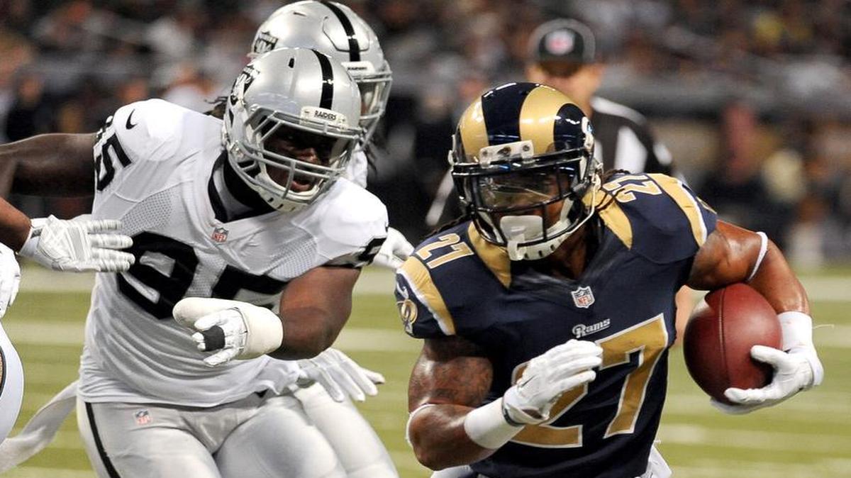 Defensive end Benson Mayowa, shown chasing Rams running back Tre Mason, is a free-agent target of the Cowboys.