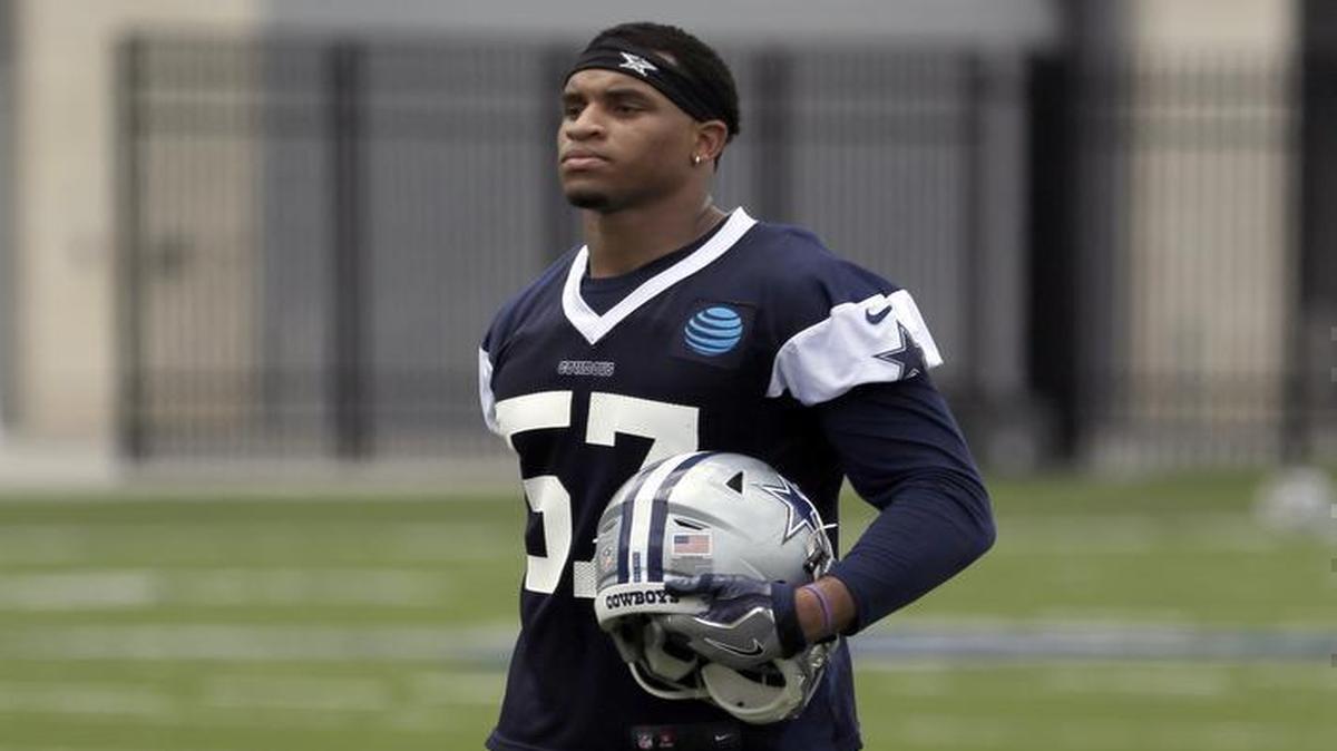 Linebacker Damien Wilson walks off the field after an NFL football practice at the team's minicamp in June.