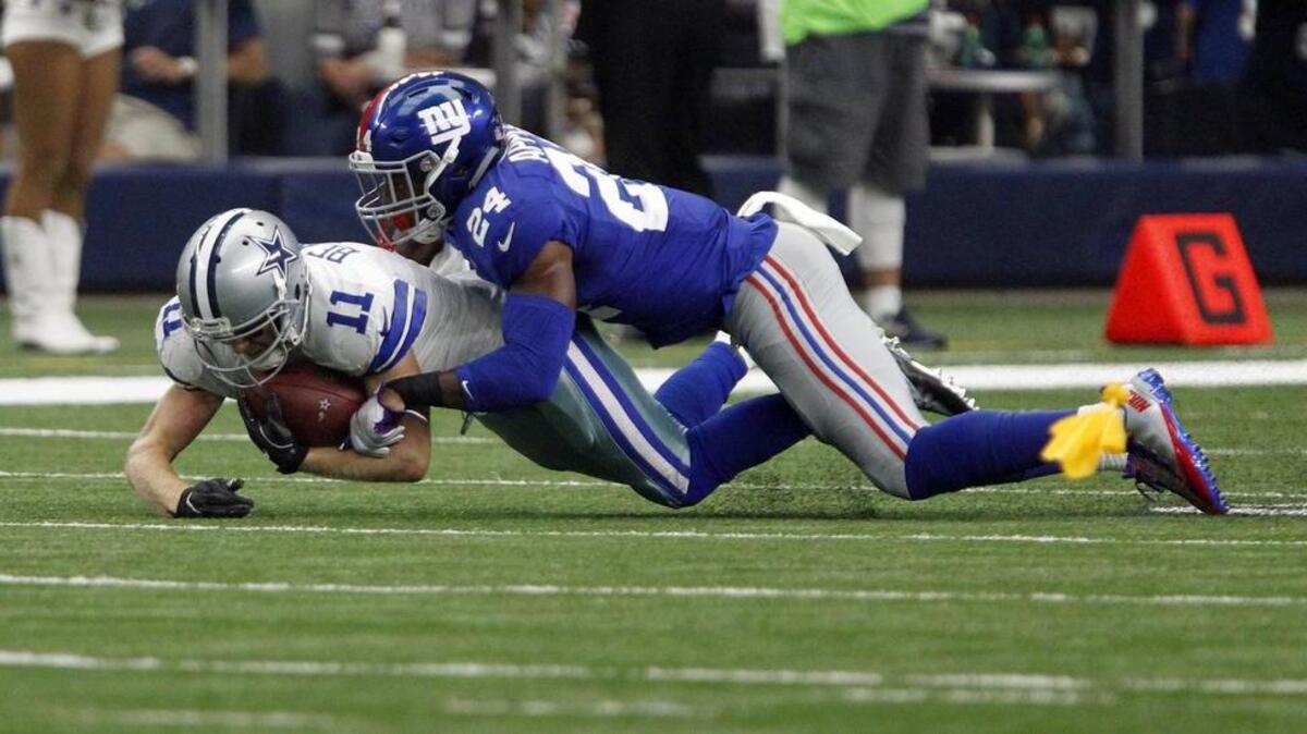 Cowboys wide receiver Cole Beasley (11), tackled by Giants cornerback Eli Apple, bemoans the one that got away.