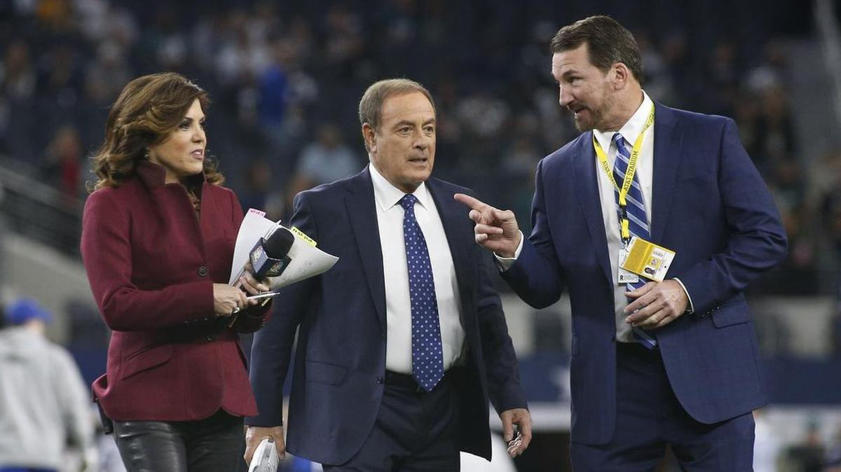 NBC Sports Michele Tafoya, left, Al Michaels and Cowboys radio announcer Babe Laufenberg talk before A Sunday Night Football game betweeen the Dallas Cowboys and the Philadelphia Eagles at AT&T Stadium in Arlington on Nov. 19.