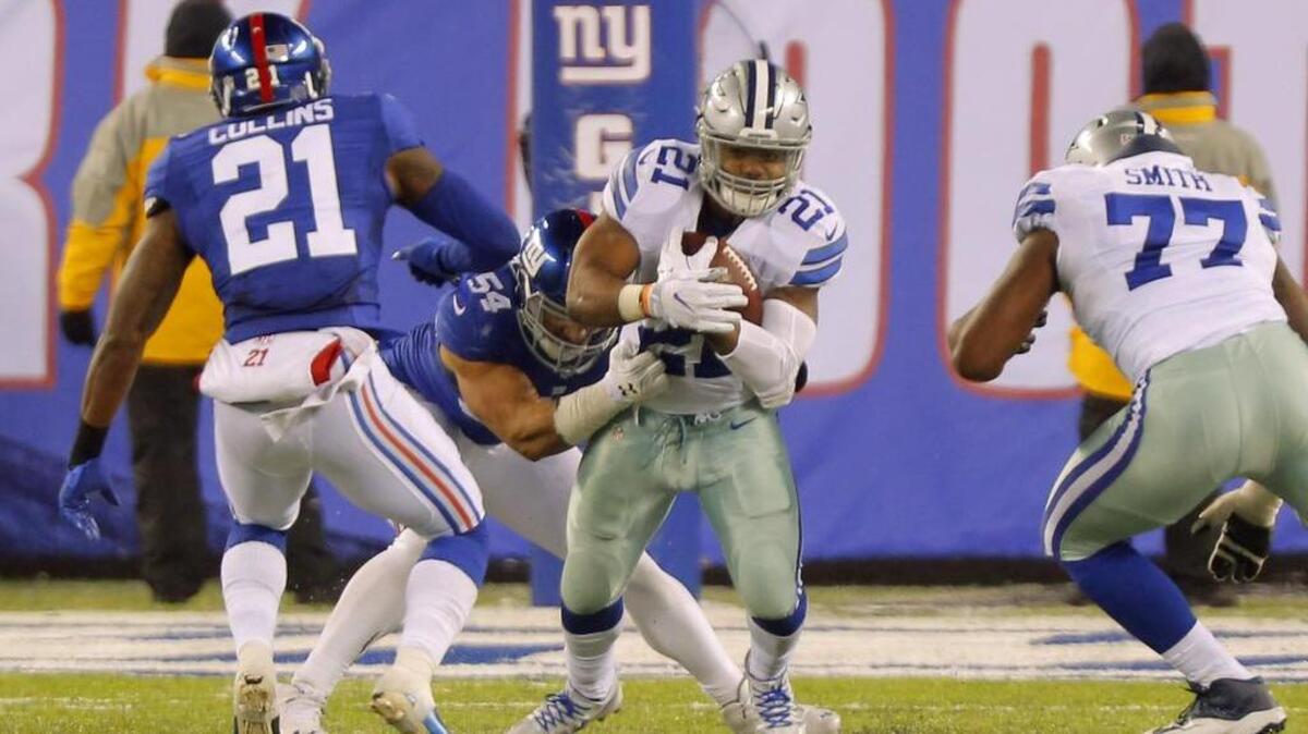Cowboys running back Ezekiel Elliott (21) had 107 yards Sunday, but it wasn’t enough for a victory.