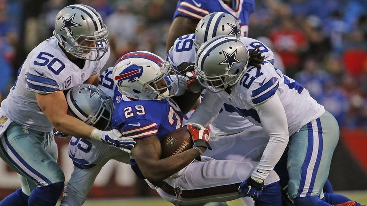 Cowboys linebacker Sean Lee, left, and safety J.J. Wilcox, right, help out on a tackle of Bills running back Karlos Williams. The Cowboys’ defense held strong until Buffalo’s game-sealing , 92-yard touchdown drive in the final minutes.