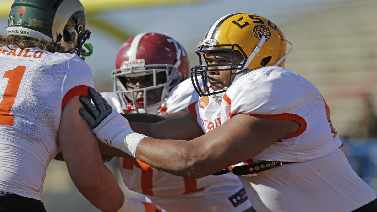 LSU offensive tackle La’el Collins, right and Alabama’s Arie Kouandjio, middle, work during drills in practice for last year’s Senior Bowl game. The Cowboys will have one of the two coaching staffs at this year’s game in Mobile, Ala., at the end of the month.