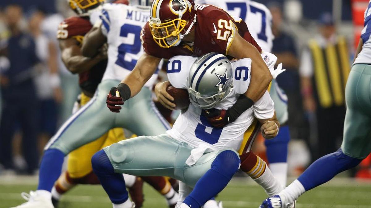 
Dallas Cowboys quarterback Tony Romo (9) is sacked by Washington Redskins inside linebacker Keenan Robinson (52) during a game last season when DeMarco Murray (29) picked up the wrong blitzer.
